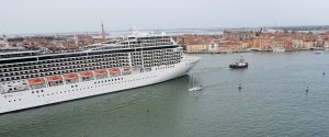 Cruise ship in the Venice Lido dwarfing the city behind.